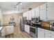 Well-equipped kitchen with modern appliances and ample cabinet space for storage at 850 Coan Dr, Locust Grove, GA 30248