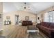 Open-concept living room showcasing hardwood floors and comfortable seating at 850 Coan Dr, Locust Grove, GA 30248