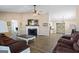 Spacious living room with a fireplace, hardwood floors, and neutral paint at 850 Coan Dr, Locust Grove, GA 30248