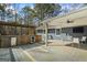 Outdoor kitchen area on a wooden deck, featuring a grill, mini-fridge, and countertop space at 850 Coan Dr, Locust Grove, GA 30248