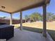 Covered patio area overlooking a flat and expansive back yard with an additional outdoor covered living space at 7019 Diamond Dr, Rex, GA 30273