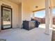 Covered patio and backyard with room for outdoor seating, grilling, and entertainment at 7019 Diamond Dr, Rex, GA 30273