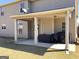 Covered patio area with access to the backyard, perfect for grilling and outdoor dining at 7019 Diamond Dr, Rex, GA 30273