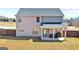Spacious backyard with a covered patio, privacy fence, and plenty of room for outdoor activities at 7019 Diamond Dr, Rex, GA 30273