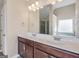 Bathroom with double vanity, large mirror, and granite countertops at 7019 Diamond Dr, Rex, GA 30273