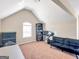 Bonus room with vaulted ceiling, carpet floor, and neutral paint makes a great office or flexible space at 7019 Diamond Dr, Rex, GA 30273