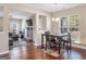 Open-concept dining room flows into the living room, with decorative fireplace, and a wall-mounted television at 7019 Diamond Dr, Rex, GA 30273