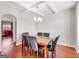 Dining room with coffered ceilings, modern chandelier, and stylish decor at 7019 Diamond Dr, Rex, GA 30273