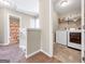 Hallway showing a bathroom and laundry room at 7019 Diamond Dr, Rex, GA 30273