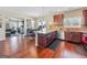 Modern kitchen with granite countertops, stainless steel appliances, and a view into the adjoining living room at 7019 Diamond Dr, Rex, GA 30273