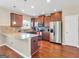 This kitchen features stainless steel appliances, granite countertops, and tile backsplash at 7019 Diamond Dr, Rex, GA 30273