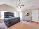Spacious main bedroom with vaulted ceilings, neutral decor, and lots of natural light at 7019 Diamond Dr, Rex, GA 30273