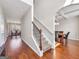 Elegant staircase leading to the upper level, with modern dining room at 7019 Diamond Dr, Rex, GA 30273