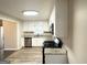 Well-lit kitchen featuring stainless steel appliances, granite countertops, and white cabinetry at 20 Maddox Dr, Locust Grove, GA 30248