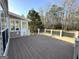 Spacious wooden deck with railing, perfect for outdoor entertaining and enjoying the backyard view at 345 Gaelic Way, Tyrone, GA 30290
