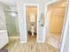 Bright bathroom featuring wood-look tile floors, glass shower and toilet room at 345 Gaelic Way, Tyrone, GA 30290