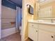 Bathroom featuring tub/shower combo with curtain and white vanity at 345 Gaelic Way, Tyrone, GA 30290