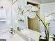 Bathroom featuring double sinks, a large mirror, and an orchid at 345 Gaelic Way, Tyrone, GA 30290
