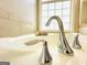 Close-up of bathtub faucet with chrome fixtures and elegant design at 345 Gaelic Way, Tyrone, GA 30290