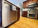 Stainless steel appliances and hardwood floors offer a modern look to this updated kitchen at 345 Gaelic Way, Tyrone, GA 30290