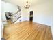 Open-concept living room with hardwood floors and great natural lighting, perfect for entertaining at 345 Gaelic Way, Tyrone, GA 30290