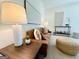Close-up of living room showcasing a comfortable leather couch and modern accent pieces at 345 Gaelic Way, Tyrone, GA 30290