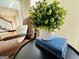 Close up of office decor with houseplant, books, and leather armchairs at 345 Gaelic Way, Tyrone, GA 30290