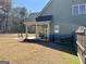 Relaxing backyard with patio, seating, and a well-maintained lawn and landscaping at 108 Caraway Rd, Locust Grove, GA 30248