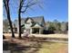 Large backyard with a covered patio perfect for outdoor enjoyment and entertaining at 108 Caraway Rd, Locust Grove, GA 30248