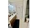 Bathroom features a double sink vanity with granite countertops and tile flooring at 108 Caraway Rd, Locust Grove, GA 30248