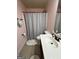 Bathroom with a shower, toilet, and vanity sink at 108 Caraway Rd, Locust Grove, GA 30248