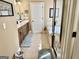Bathroom showcasing a tiled floor, double vanity, glass shower, and a separate bathtub at 108 Caraway Rd, Locust Grove, GA 30248