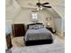 Carpeted bedroom with neutral walls, dressers and a ceiling fan with overhead lighting at 108 Caraway Rd, Locust Grove, GA 30248