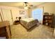 Bedroom with carpet, a ceiling fan, a window, and a shelving unit at 108 Caraway Rd, Locust Grove, GA 30248