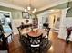 Stylish dining room featuring a round table, decorative columns, and sophisticated decor at 108 Caraway Rd, Locust Grove, GA 30248