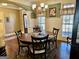 Elegant dining room with wood floors, wainscoting, and ample natural light at 108 Caraway Rd, Locust Grove, GA 30248