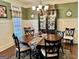Well-appointed dining room featuring a decorative china cabinet, round table, and classic design elements at 108 Caraway Rd, Locust Grove, GA 30248