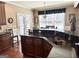 Kitchen with stainless steel sink and dining table with chairs at 108 Caraway Rd, Locust Grove, GA 30248