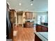 Gourmet kitchen with wood floors, stainless appliances, granite counters and island with seating at 108 Caraway Rd, Locust Grove, GA 30248
