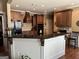 Well-appointed kitchen featuring granite countertops, a central island, and stainless steel appliances at 108 Caraway Rd, Locust Grove, GA 30248