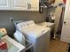 Functional laundry room with washer, dryer, sink, and storage at 108 Caraway Rd, Locust Grove, GA 30248