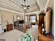 Large main bedroom with a tray ceiling, neutral carpet and many furnishings at 108 Caraway Rd, Locust Grove, GA 30248