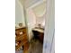 Small home office nook in the bedroom with a desk, chair, and shelf at 108 Caraway Rd, Locust Grove, GA 30248