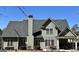 Well-maintained rear exterior with a covered patio area great for relaxing and entertaining guests at 108 Caraway Rd, Locust Grove, GA 30248