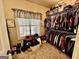 Walk-in closet featuring lots of hanging space, organizers, and a window at 108 Caraway Rd, Locust Grove, GA 30248