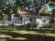 A charming home with a ramp for easy access to the rear entrance and a large yard at 718 N Hairston Rd, Stone Mountain, GA 30083