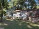 Expansive backyard featuring lush greenery and mature trees for privacy at 718 N Hairston Rd, Stone Mountain, GA 30083