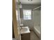 Practical bathroom featuring a toilet, shower and tub combination and a vanity at 718 N Hairston Rd, Stone Mountain, GA 30083