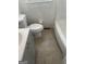 Functional bathroom featuring a toilet, shower and tub combination and a vanity at 718 N Hairston Rd, Stone Mountain, GA 30083