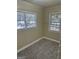 Bright bedroom with carpet, two windows and natural light at 718 N Hairston Rd, Stone Mountain, GA 30083